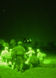 Stryker Soldiers mount air assault against al-Qaeda in Iraq - Soldiers with 5th Battalion, 20th Infantry Regiment move toward a Chinook helicopter south of Baqubah April 17. The battalion air assaulted into the farming community in search of al-Qaeda in Iraq terrorists that might have fled there during a clearing operation in Buhriz two days earlier. Soldiers of 5-20 Inf. Regt., 3rd Stryker Brigade Combat Team, 2nd Infantry Division, from Fort Lewis, Wash., captured a dozen suspected terrorists during the 24-hour operation, including an entire cell responsible for mortar attacks on coalition forces in Baqubah. They also found several small caches which included grenades, AK-47s, ammunition, bomb-making materials and terrorist propaganda. (U.S. Army photo by Staff Sgt. Antonieta Rico, 5th Mobile Public Affairs Detachment)
