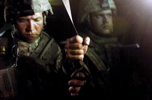 Pvt. Eric Rundquist, left, and Pvt. Jason Taylor, both with 1st Platoon, Company B, 1-12 Combined Arms Battalion, 3rd Brigade Combat Team, 1st Cavalry Division, hold on to a strap inside a Bradley fighting vehicle after the Bradley hit a roadside bomb. The Soldiers were en route to the Forward Operating Base Gabe medical station after one of their fellow Soldiers was injured when they encountered sporadic sniper fire for about two hours during a house-clearing mission in the Tahrir neighborhood of Baqubah.